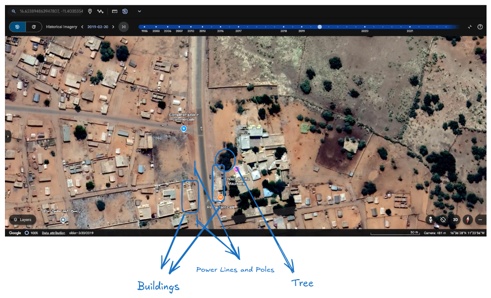 Close-up in Google Earth Pro showing road layout and buildings in Kiffa that match tweet image details.